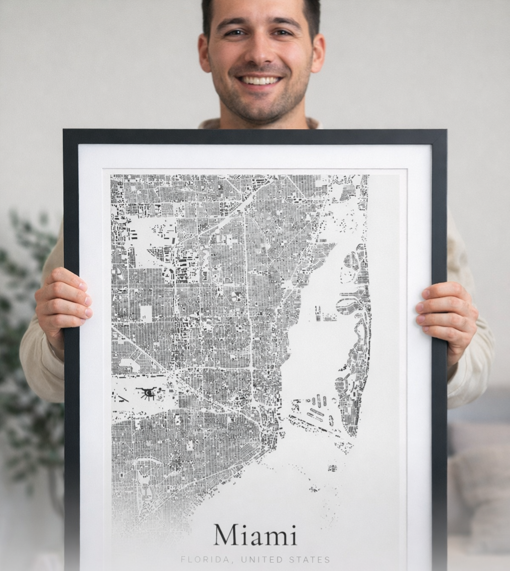 Customer holding framed Miami building footprint map print