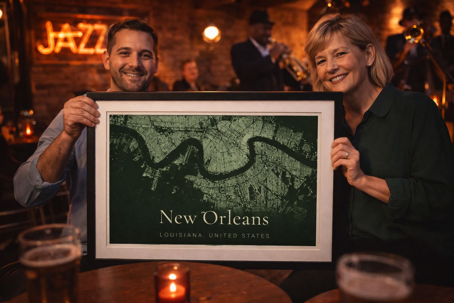 Couple holding framed New Orleans building footprint map print in jazz bar