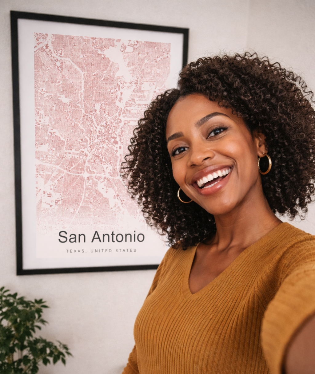 Woman taking selfie with San Antonio building footprint map print on wall